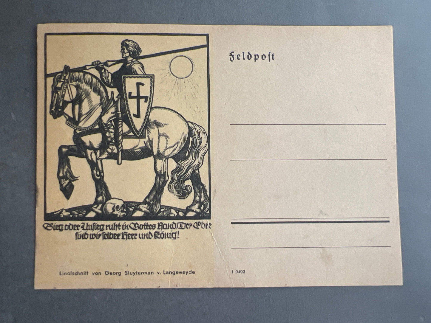 WW2 Tysk Feldpost. Ideologisk motiv med det antikke hagekors på skjoldet. Ubrugt. Original.