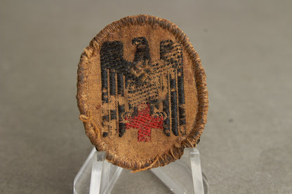 WW2 Tysk DRK (Deutsches Rotes Kreuz) Skråhue Mærke. Original.